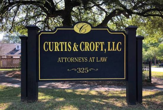 Firm sign reading Curtis & Croft, LLC | Attorneys At Law | 325